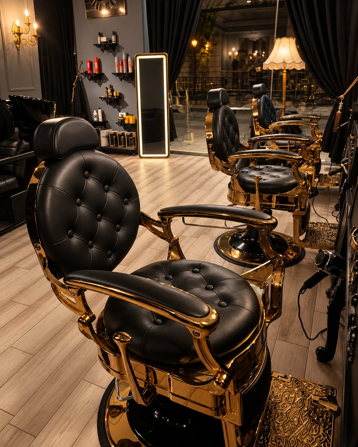 Close view of a black leather barber chair with gold trim